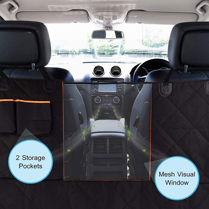 Car interior with a pet barrier featuring storage pockets and a mesh window.