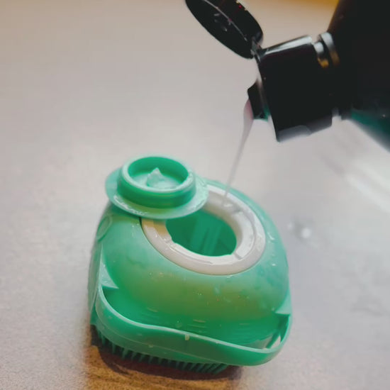 dog bath massage brush with dog shampoo inside